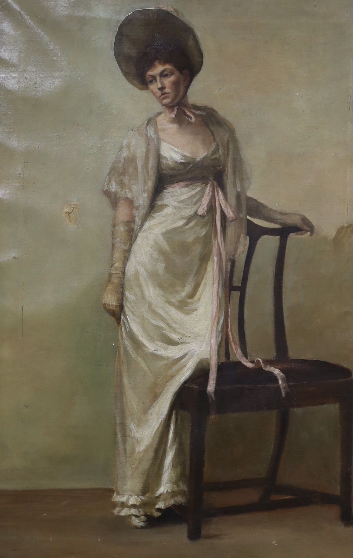 English School c.1900, oil on canvas, Full length portrait of a lady standing beside a chair, 74 x 47cm